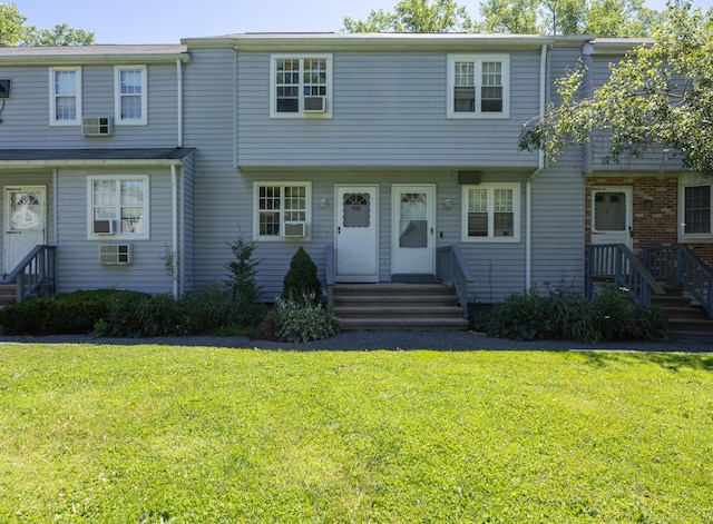 view of front of property with a front lawn and entry steps