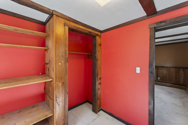 unfurnished bedroom with a baseboard heating unit