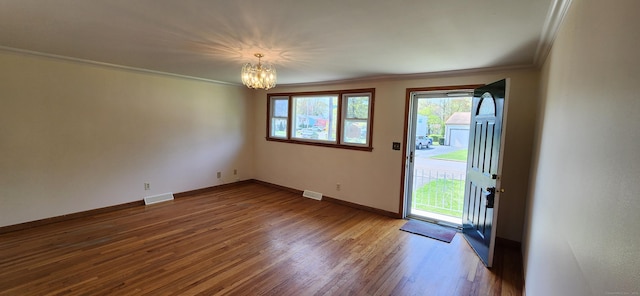 116 Aimes Dr, West Haven, CT 06516 - interior space featuring visible vents, crown molding, wood finished floors, baseboards, and a notable chandelier