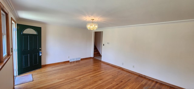116 Aimes Dr, West Haven, CT 06516 - foyer with crown molding, a chandelier, light wood-style flooring, stairs, and visible vents