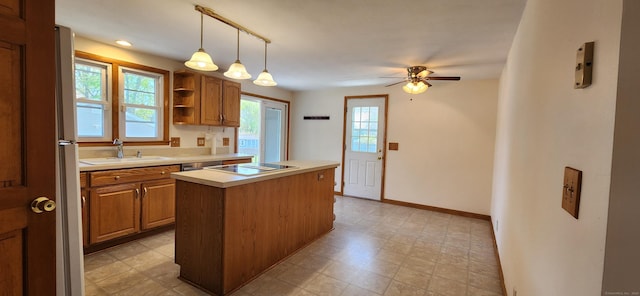 116 Aimes Dr, West Haven, CT 06516 - kitchen with ceiling fan, a center island, black electric cooktop, a sink, and light countertops