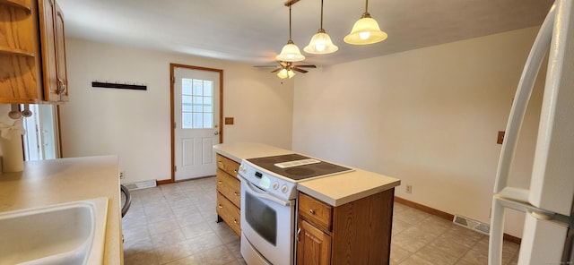 116 Aimes Dr, West Haven, CT 06516 - kitchen with brown cabinetry, ceiling fan, white electric range, a center island, and light countertops