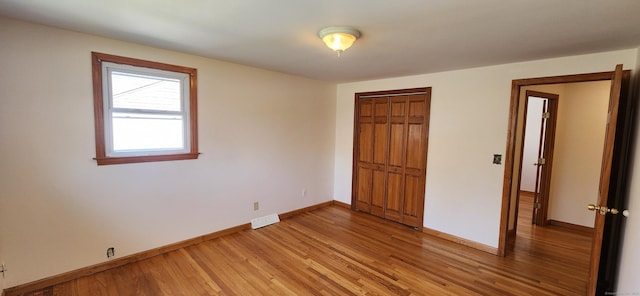 116 Aimes Dr, West Haven, CT 06516 - unfurnished bedroom with a closet, baseboards, visible vents, and light wood-type flooring