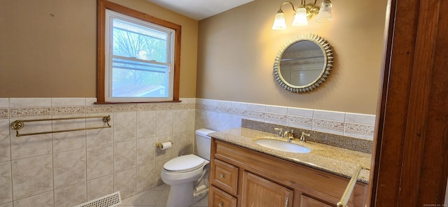 116 Aimes Dr, West Haven, CT 06516 - bathroom featuring toilet, tile patterned floors, tile walls, and vanity