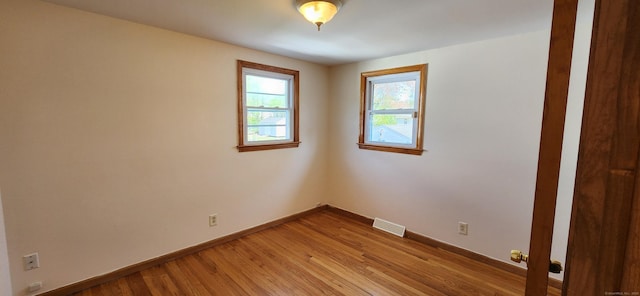 116 Aimes Dr, West Haven, CT 06516 - empty room featuring baseboards, light wood finished floors, and visible vents