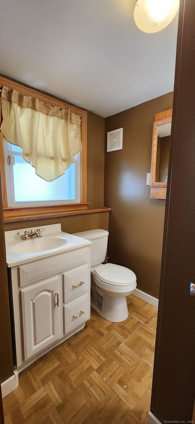 116 Aimes Dr, West Haven, CT 06516 - bathroom with visible vents, baseboards, toilet, and vanity