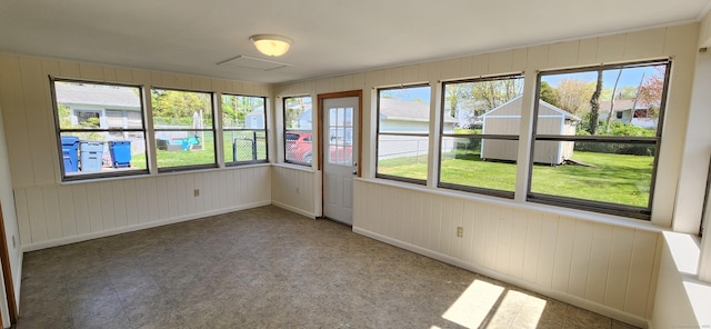 116 Aimes Dr, West Haven, CT 06516 - unfurnished sunroom with baseboards and wood walls
