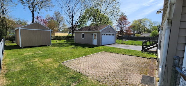 116 Aimes Dr, West Haven, CT 06516 - view of yard featuring an outbuilding, a detached garage, fence, a patio, and stairs