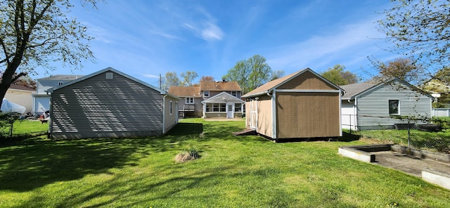 116 Aimes Dr, West Haven, CT 06516 - back of property with a lawn, fence, an outbuilding, and a shed