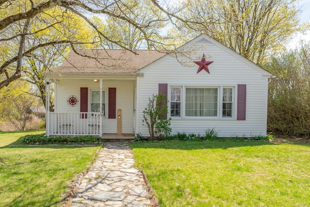23 Strosberg Rd, Waterford, CT 06385 - view of front facade featuring covered porch and a front yard