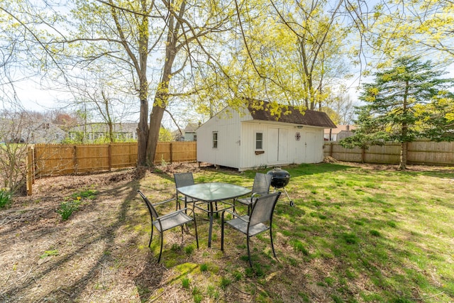 23 Strosberg Rd, Waterford, CT 06385 - view of yard with an outdoor structure, outdoor dining area, and a fenced backyard