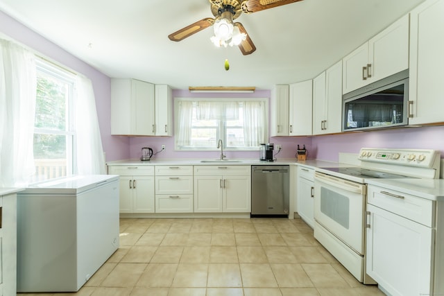 23 Strosberg Rd, Waterford, CT 06385 - kitchen with a sink, appliances with stainless steel finishes, plenty of natural light, and light countertops