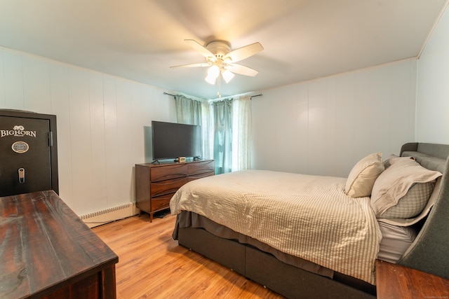 23 Strosberg Rd, Waterford, CT 06385 - bedroom featuring a baseboard radiator, a ceiling fan, and wood finished floors