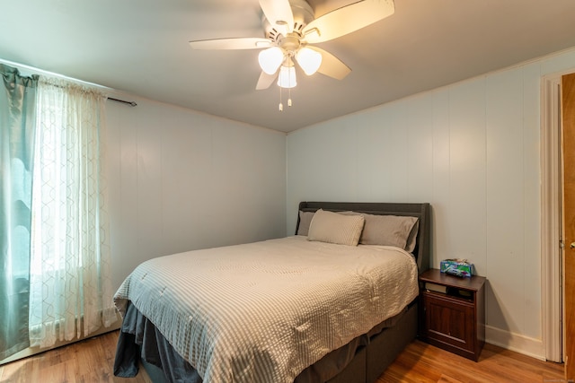 23 Strosberg Rd, Waterford, CT 06385 - bedroom with light wood-style floors, ceiling fan, and a decorative wall