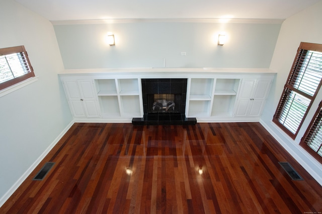 22 Maple Ln Unit 22, Avon, CT 06001 - unfurnished living room with wood finished floors, baseboards, and a tiled fireplace