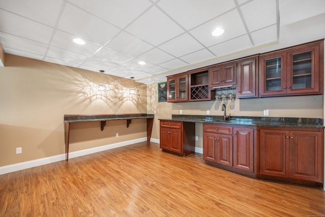 85 Chippenwood Ln, Bristol, CT 06010 - kitchen featuring light wood-style floors, baseboards, recessed lighting, and glass insert cabinets