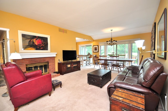 carpeted living area with a chandelier and a fireplace