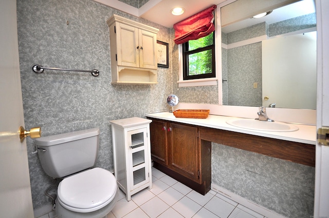 bathroom with tile patterned flooring, toilet, and vanity