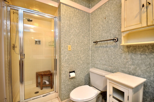 full bathroom featuring toilet and a stall shower