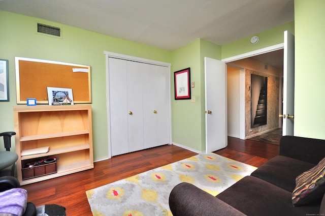 living room featuring wood finished floors and baseboards