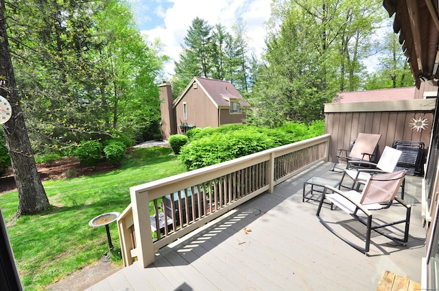 wooden deck with a yard