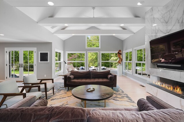 1580 Ponus Rdg, New Canaan, CT 06840 - living area with a premium fireplace, french doors, wood finished floors, baseboards, and recessed lighting