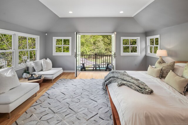 1580 Ponus Rdg, New Canaan, CT 06840 - bedroom featuring vaulted ceiling, access to outside, multiple windows, light wood-style floors, and baseboards