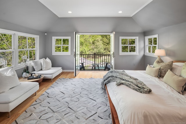 1580 Ponus Rdg, New Canaan, CT 06840 - bedroom featuring vaulted ceiling, access to exterior, multiple windows, light wood finished floors, and baseboards