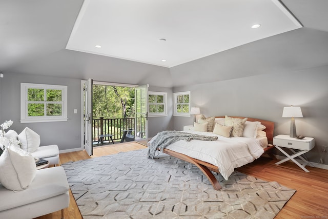 1580 Ponus Rdg, New Canaan, CT 06840 - bedroom featuring access to outside, vaulted ceiling, light wood finished floors, multiple windows, and baseboards