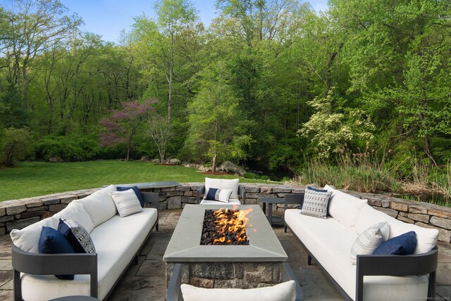 1580 Ponus Rdg, New Canaan, CT 06840 - view of patio with an outdoor living space with a fire pit and a forest view