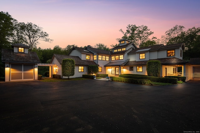 1580 Ponus Rdg, New Canaan, CT 06840 - view of front of home featuring an outdoor structure, driveway, and stucco siding