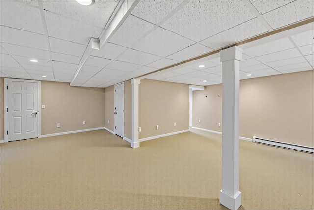 finished basement with carpet flooring, recessed lighting, baseboards, and a drop ceiling
