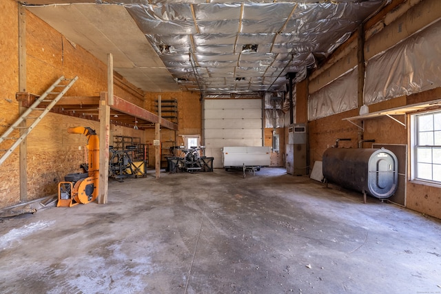 garage featuring heating unit and heating fuel