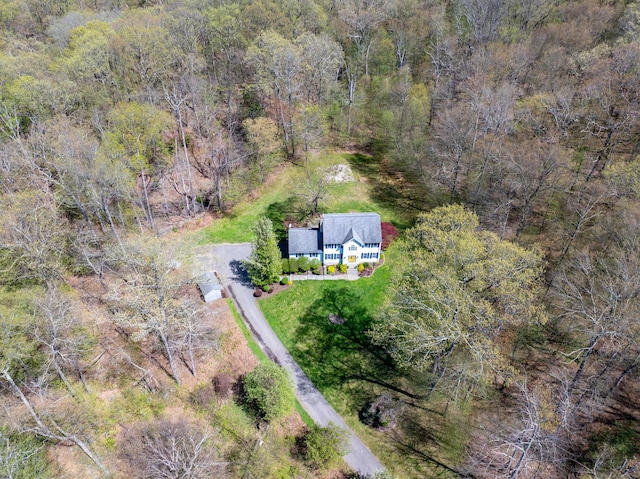 drone / aerial view with a view of trees
