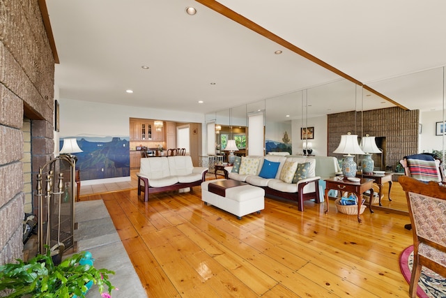 919 Pequot Ave, New London, CT 06320 - living room featuring light wood-type flooring, a fireplace, and recessed lighting