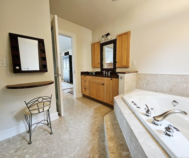 919 Pequot Ave, New London, CT 06320 - bathroom featuring vanity, a tub with jets, and tile patterned flooring