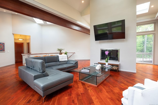 88 Green Ln, Ridgefield, CT 06877 - living area with high vaulted ceiling, a skylight, wood finished floors, recessed lighting, and a fireplace