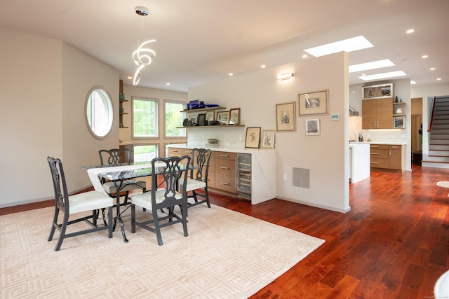 88 Green Ln, Ridgefield, CT 06877 - dining area featuring wine cooler, recessed lighting, dark wood-type flooring, a skylight, and stairway