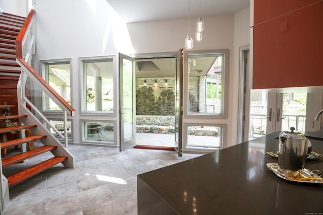 88 Green Ln, Ridgefield, CT 06877 - doorway to outside with stairs and stone finish flooring