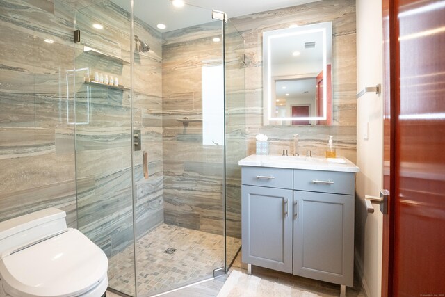 88 Green Ln, Ridgefield, CT 06877 - full bath with tile walls, a shower stall, toilet, and vanity