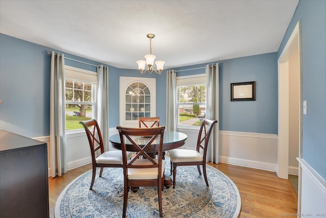 404 Brimfield Rd, Wethersfield, CT 06109 - dining space featuring a chandelier, light wood-style flooring, and baseboards