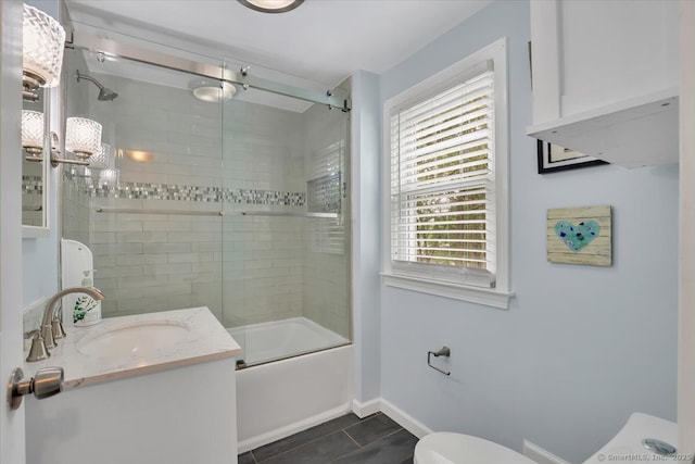 404 Brimfield Rd, Wethersfield, CT 06109 - full bath featuring toilet, vanity, tile patterned floors, bath / shower combo with glass door, and baseboards