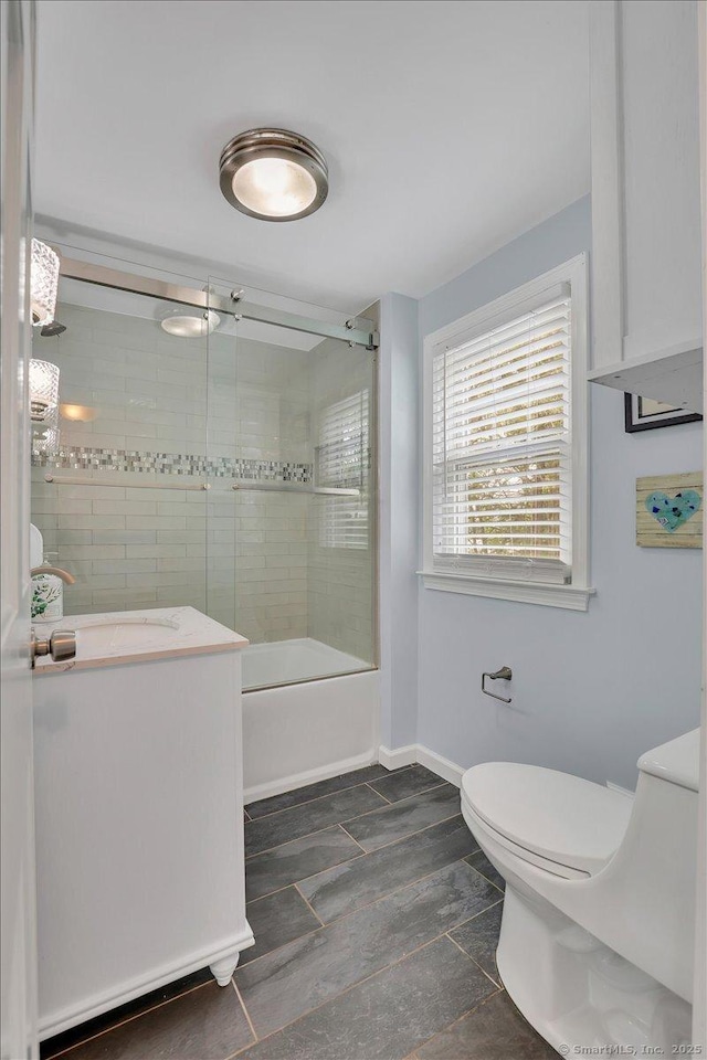 404 Brimfield Rd, Wethersfield, CT 06109 - bathroom with shower / bath combination with glass door, toilet, vanity, and baseboards