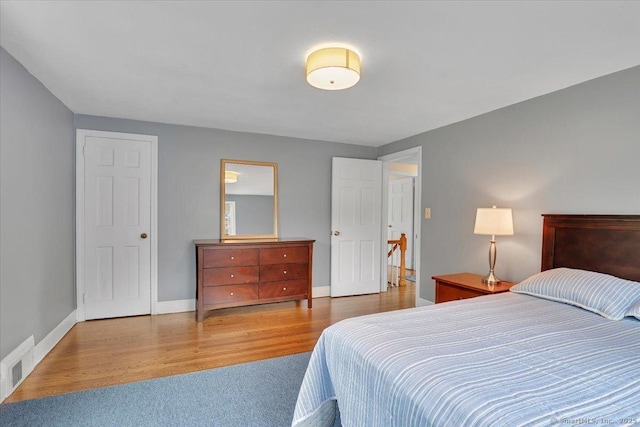 404 Brimfield Rd, Wethersfield, CT 06109 - bedroom with baseboards, wood finished floors, and carpet