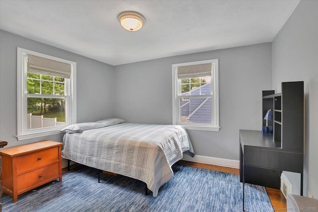 404 Brimfield Rd, Wethersfield, CT 06109 - bedroom with wood finished floors and baseboards