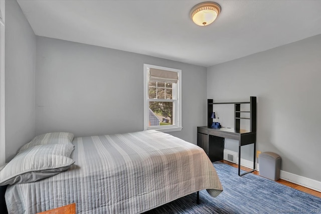 404 Brimfield Rd, Wethersfield, CT 06109 - bedroom with wood finished floors and baseboards