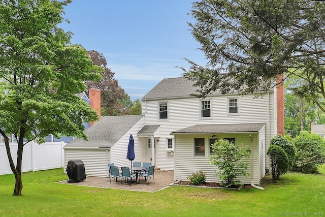 404 Brimfield Rd, Wethersfield, CT 06109 - back of property featuring a chimney, a patio, and a shingled roof