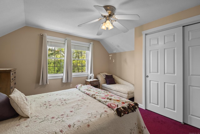 carpeted bedroom with lofted ceiling and ceiling fan