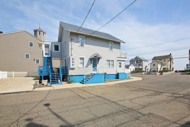 rear view of house featuring a residential view