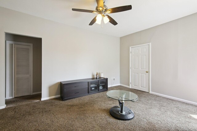 unfurnished room with carpet, a ceiling fan, and baseboards